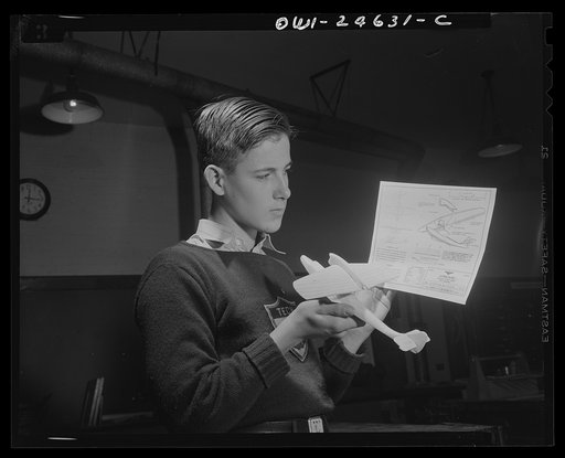 Untitled photo, possibly related to: Montgomery Blair High School, Silver Spring, Maryland. Making model planes according to Navy specifications to be used in the training of military and civilian personnel