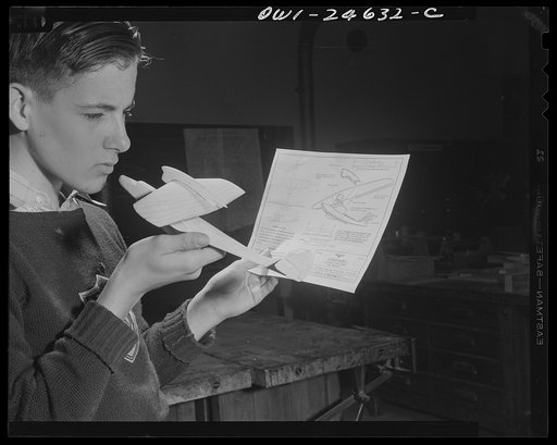 Untitled photo, possibly related to: Montgomery Blair High School, Silver Spring, Maryland. Making model planes according to Navy specifications to be used in the training of military and civilian personnel