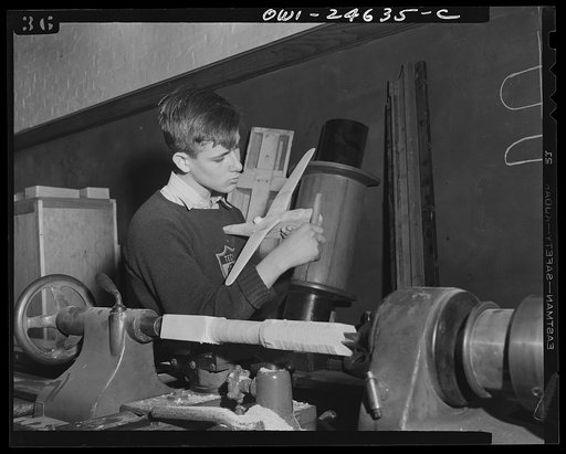 Untitled photo, possibly related to: Montgomery Blair High School, Silver Spring, Maryland. Making model planes according to Navy specifications to be used in the training of military and civilian personnel