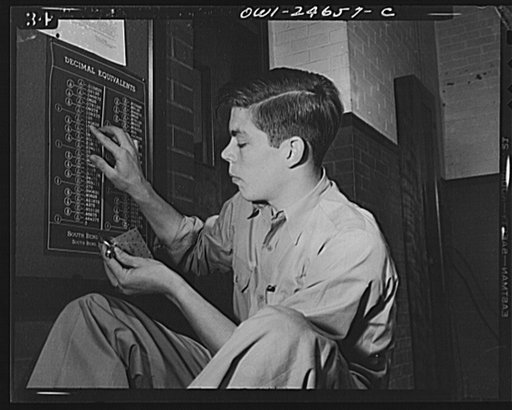 Montgomery Blair High School, Silver Spring, Maryland. Victory Corps boy learning bench metal mathematics
