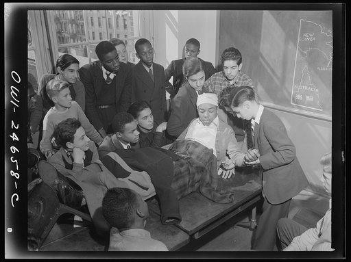 Benjamin Franklin High School, New York, New York. Boys take one day a week from their English course for "war activities" in order to learn the basic principles of first aid