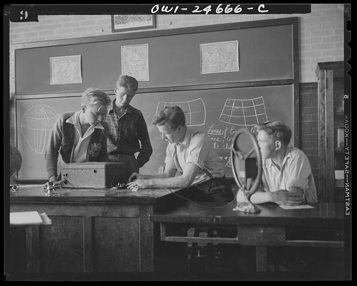 Benjamin Franklin High School, New York, New York. High school boys in a pre-flight class which is conducted by a young woman instructor
