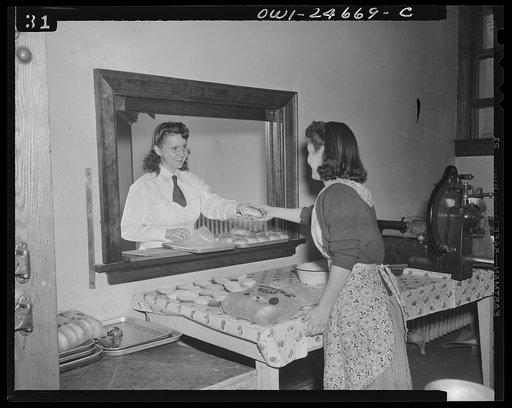 Benjamin Franklin High School, New York, New York. Home economics students contributing to the school's Victory Corps program by preparing and serving food in the student-operated cafeteria