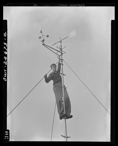 Benjamin Franklin High School, New York, New York. Victory Corps boy learning to use the school's weather vane in weather forecasting, as part of his pre-aeronautics training in meteorology