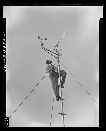 Benjamin Franklin High School, New York, New York. Victory Corps boy learning to use the school's weather vane in weather forecasting, as part of his pre-aeronautics training in meteorology