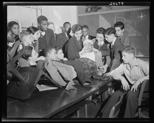 Benjamin Franklin High School, New York, New York. Boys take one day a week from their English course for "war activities" in order to learn the basic principles of first aid