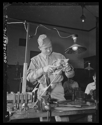 Montgomery Blair High School, Silver Spring, Maryland. Victory Corps boy learning bench metal work