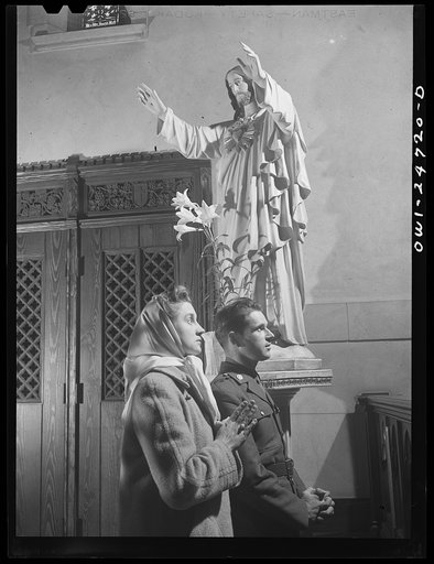 Buffalo, New York. Frank and Laura Czaya praying in church one week after Easter. They were married six months before Frank was drafted. He is now a corporal, stationed in Arkansas and is home on a ten day furlough. Laura works in the Symington-Gould plant; lives in an apartment with her family in D