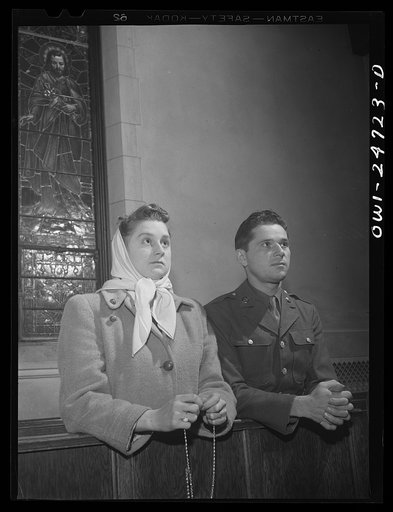 Buffalo, New York. Frank and Laura Czaya praying in church one week after Easter. They were married six months before Frank was drafted. He is now a corporal, stationed in Arkansas and is home on a ten day furlough. Laura works in the Symington-Gould plant; lives in an apartment with her family in D
