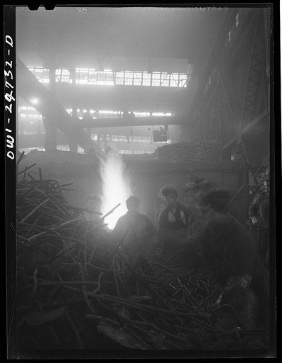 Untitled photo, possibly related to: Buffalo, New York. Symington-Gould, makers of tank, ship, and railroad parts. Rod department. Metal rods are used to reinforce the sand in most molds. After the mold has been used, rods are shaken out of the sand and transported to the Rod department. Here women 