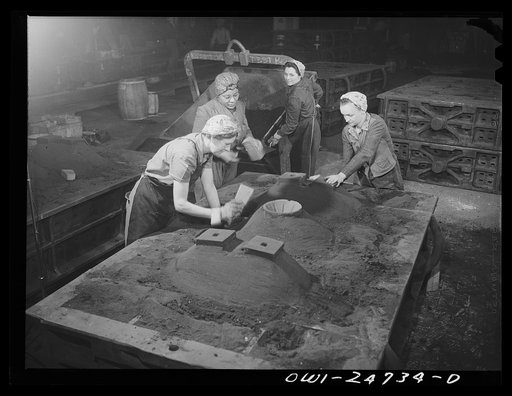 Untitled photo, possibly related to: Buffalo, New York. Symington-Gould, makers of tank, ship, and railroad parts. Mold department. After molds have been pounded with air hammer, women put heads on the molds, that is put extra protective sand on top, and insert the cut core (round funnel to left of 