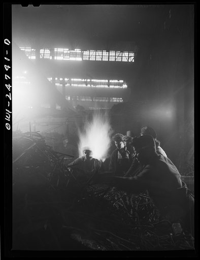Untitled photo, possibly related to: Buffalo, New York. Symington-Gould, makers of tank, ship, and railroad parts. Rod department. Metal rods are used to reinforce the sand in most molds. After the mold has been used, rods are shaken out of the sand and transported to the Rod department. Here women 