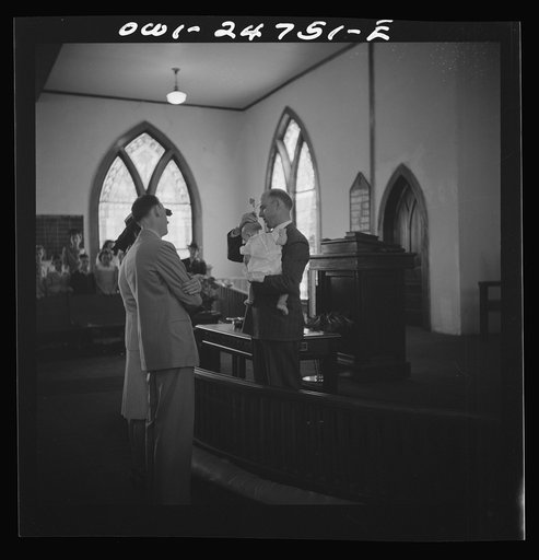 San Augustine, Texas. Reverend Dubberly baptizing a child