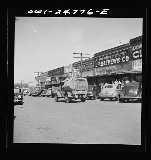 Untitled photo, possibly related to: San Augustine, Texas. Troop movement through the main street