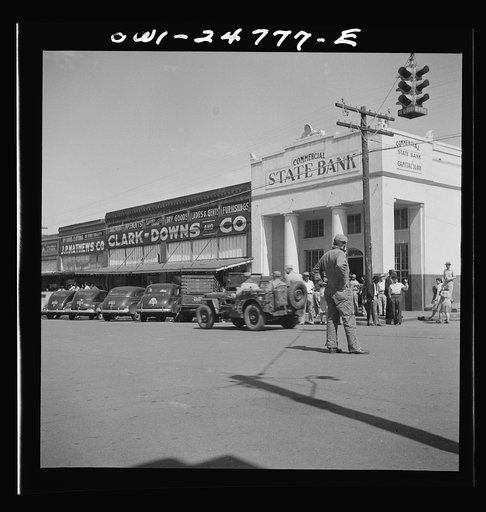 Untitled photo, possibly related to: San Augustine, Texas. Troop movement through the main street