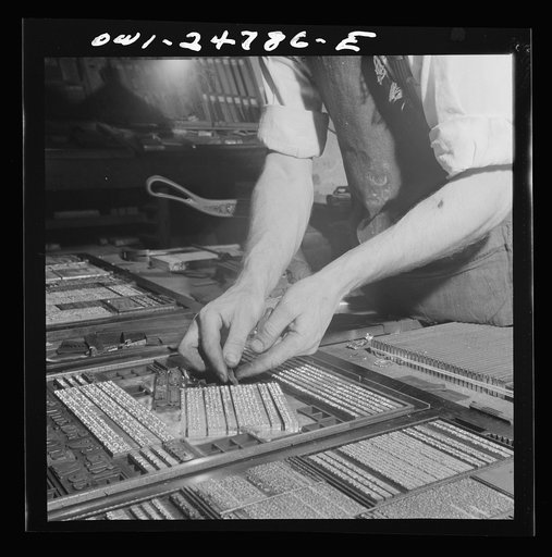 San Augustine, Texas. Harlan [i.e. Arlan] Hayes working at night, setting up page for weekly edition of the San Augustine Tribune