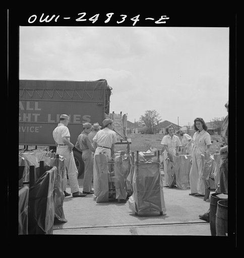 Untitled photo, possibly related to: San Augustine, Texas. Girls loading chairs which they made in NYA (National Youth Administration) woodworking shop onto a truck