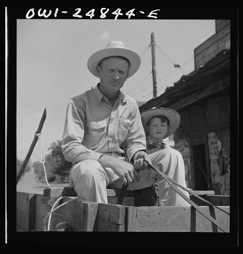San Augustine, Texas. Farmer and his son in town on Saturday afternoon
