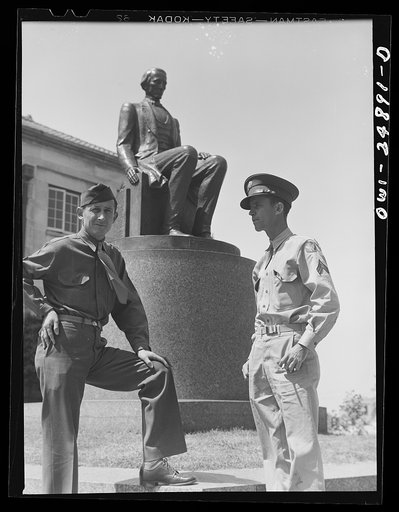 San Augustine, Texas. Two soldiers home on furlough talking in front of the courthouse