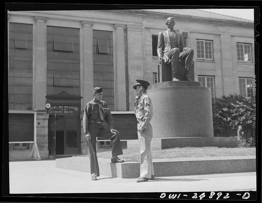 San Augustine, Texas. Two soldiers home on furlough talking in front of the courthouse
