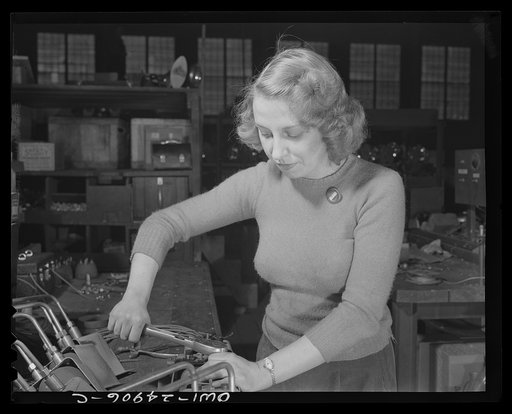 Milwaukee, Wisconsin. War production workers at the Heil Company making gasoline trailer tanks for the U.S. Army Air Corps. Lucile Mazurek, age twenty-nine, whose husband is in the armed service. She assembles black-out lamps for trainers