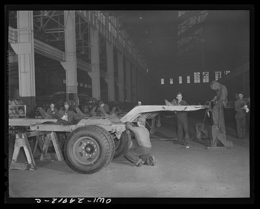 Milwaukee, Wisconsin. War production workers at the Heil Company making gasoline trailer tanks for the U.S. Army Air Corps. Assembling a chassis