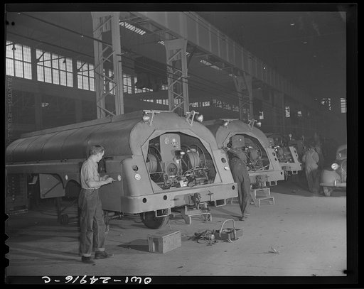 Untitled photo, possibly related to: Milwaukee, Wisconsin. War production workers at the Heil Company making gasoline trailer tanks for the U.S. Army Air Corps. Assembling parts