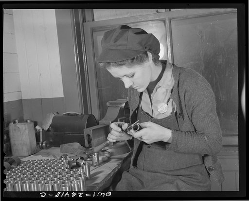 Milwaukee, Wisconsin. War production workers making M5 and M7 guns for the U.S. Army. Ex-housewife, age twenty-four, filing small parts. Her husband and brother are in the armed service