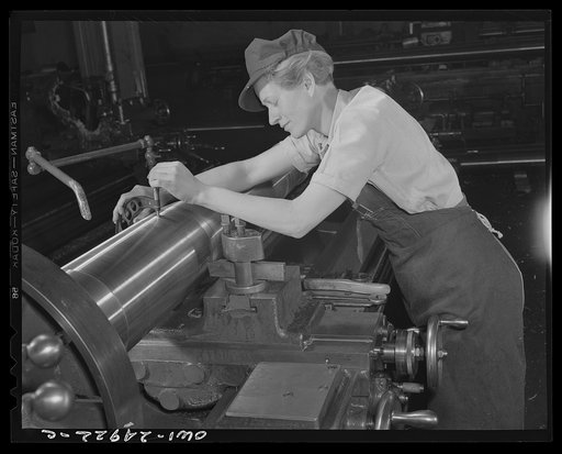 Milwaukee, Wisconsin. War production workers making M5 and M7 guns for the U.S. Army. Ex-stage orchestra musician, checking a M7 gun with gage, after turning out on a gun lathe. Her two brothers and husband are in the armed service