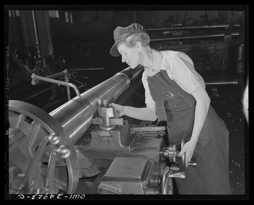 Untitled photo, possibly related to: Milwaukee, Wisconsin. War production workers making M5 and M7 guns for the U.S. Army. Ex-stage orchestra musician, checking a M7 gun with gage, after turning out on a gun lathe. Her two brothers and husband are in the armed service