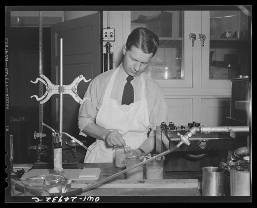 Chicago, Illinois. Subsistence research laboratory of the U.S. Army quartermaster depot. E.A. Vaupel, baking technician and cereal chemist making pH activity test on ration biscuits