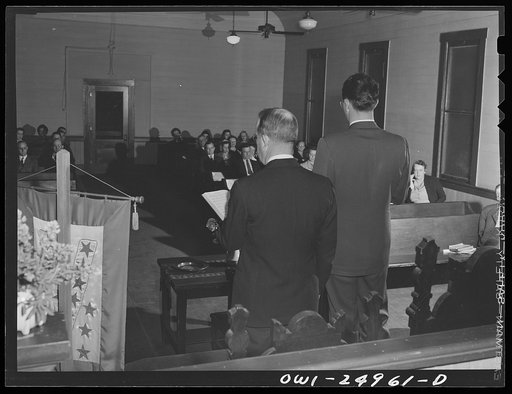 San Augustine, Texas. Reverend Marsh Calloway and the song leader conducting evening service in the Presbyterian church
