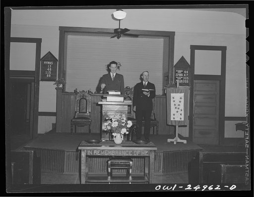 San Augustine, Texas. Reverend Marsh Calloway and the song leader conducting evening service in the Presbyterian church
