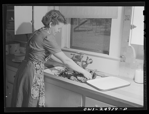 San Augustine, Texas. Mrs. Jim Halberd [i.e., Halbert], wife of the sheriff, washing turnip greens