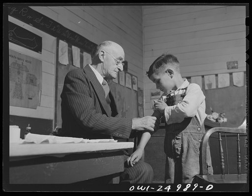 San Augustine, Texas. Dr. Schreiber of San Augustine giving a typhoid innoculation at a rural school