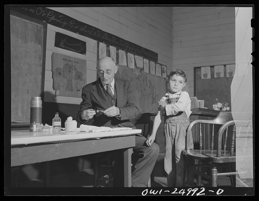 San Augustine, Texas. Dr. Schreiber of San Augustine giving typhoid innoculations at a rural school
