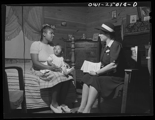 San Augustine, Texas. Amanda Gayer, the county nurse, advising a mother on child care problems