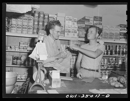 San Augustine, Texas. I.V. Childers, grocer, with his clerk who has just turned eighteen and is going to be inducted into the Army