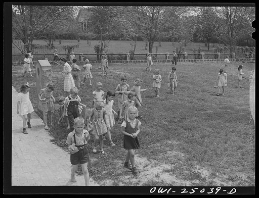 San Augustine, Texas. Easter egg hunt on the school lawn on the last day before Easter vacation