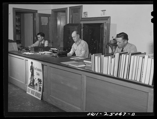Untitled photo, possibly related to: San Augustine, Texas. Troy Mitchell, city manager, at his desk in City Hall