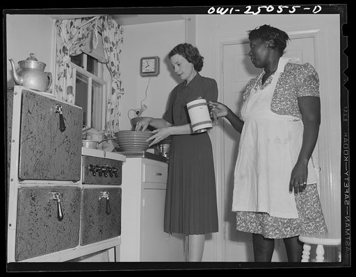 San Augustine, Texas. Mrs. Ramsey, a lawyer's wife, with her maid in the kitchen