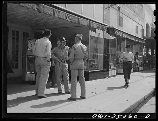 San Augustine, Texas. Soldier home on furlough talking with friends on the main street