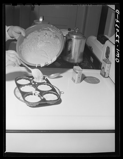 Untitled photo, possibly related to: San Augustine, Texas. Mrs. Alonzo Rushing, wife of the mayor, making cornbread biscuits