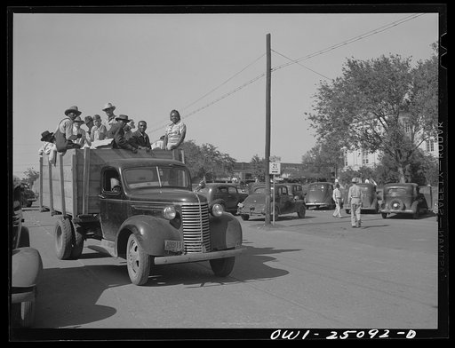Untitled photo, possibly related to: San Augustine, Texas. Farmer with the truck in which he carries farm people from twenty miles distance to town on Saturdays. He has been doing this since gas rationing began