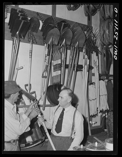 San Augustine, Texas. Man purchasing a shovel at the hardware store