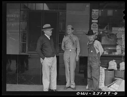 San Augustine, Texas. Soldier home on furlough talking with friends on the main street