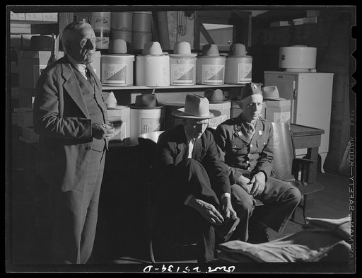 San Augustine, Texas. Buying a pair of shoes in the A.J. Wood clothing store
