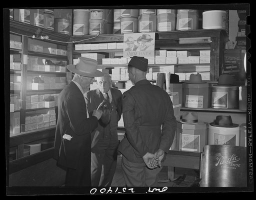 San Augustine, Texas. Buying shoes in the A.J. Wood store
