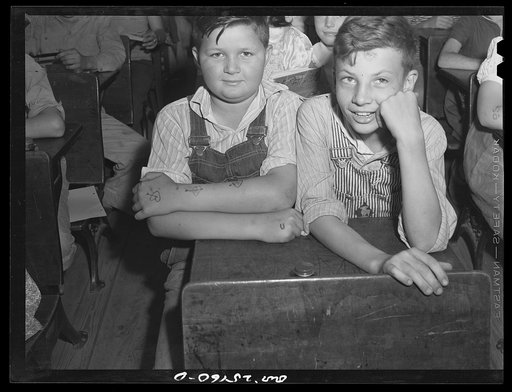 San Augustine, Texas. Schoolboys with ink made tattoo marks on their arms