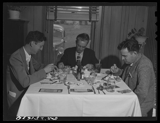 San Augustine, Texas. A newspaper man, a merchant, and a banker at the table of the Lions Club luncheon